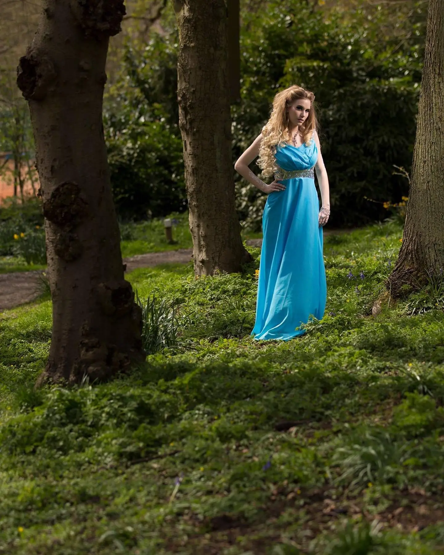 Cinderella themed portrait photoshoot in Moseley Birmingham by Omar Saleem featuring a model in a blue gown in a park setting